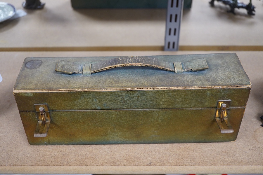 A green leather sectioned box containing a collection of cut glass, silver mounted and silver plated boxes and jars, some with guilloche enamel lids, largest 7cm high